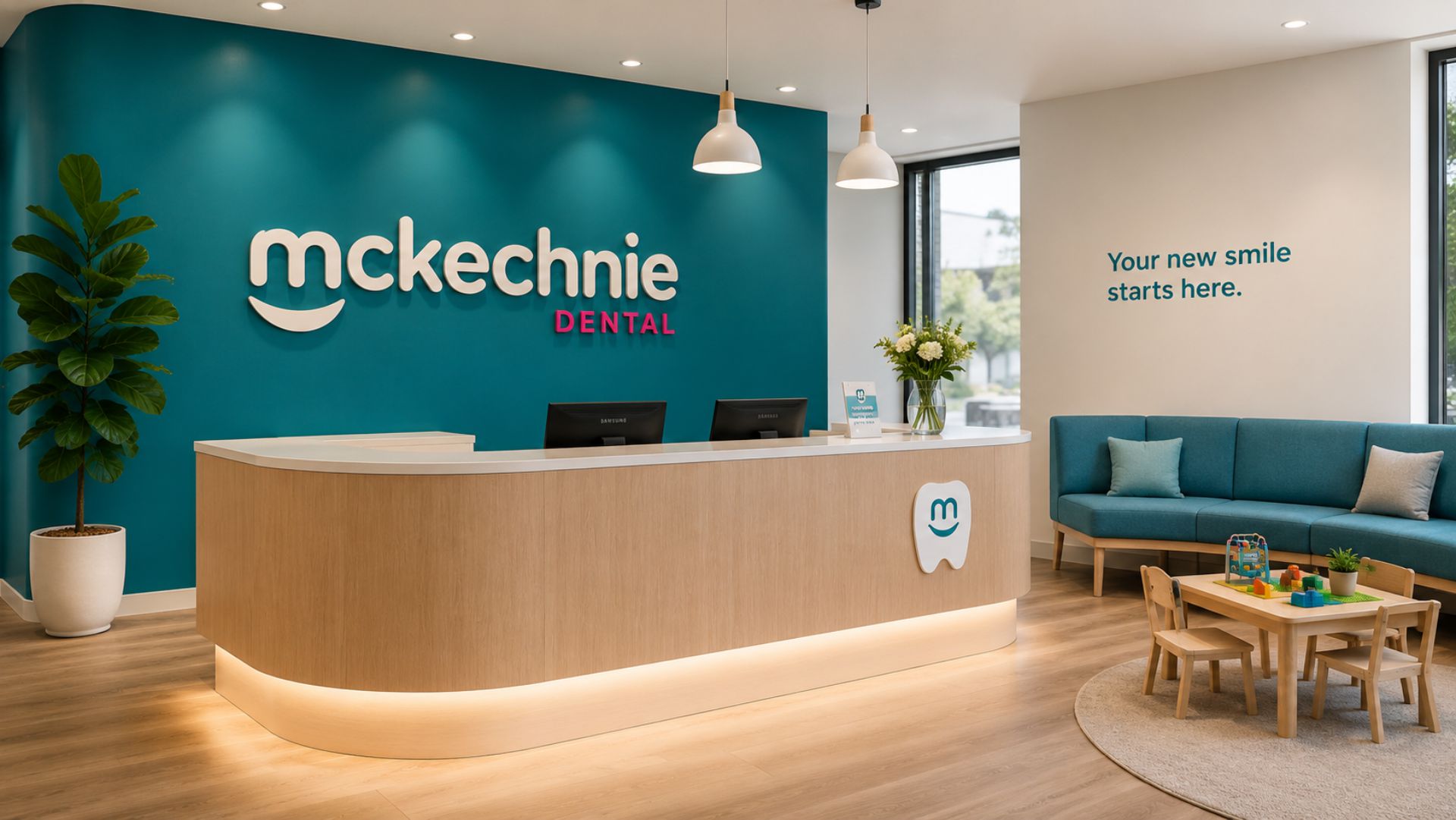 The McKechnie Dental reception with the smiling logo on a teal feature wall